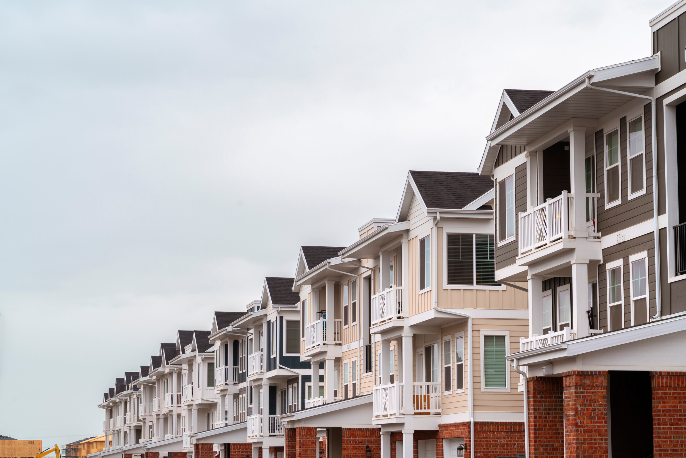 Row of modern upmarket duplex apartments day light